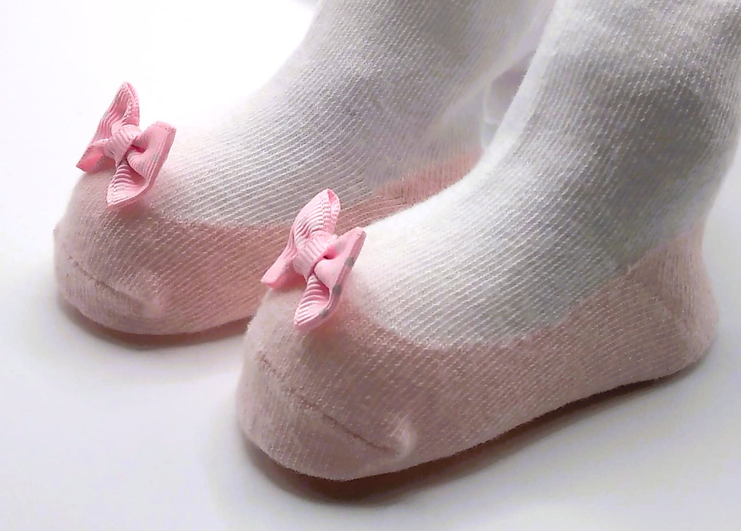 White tights with pink pump and polka dot bow
