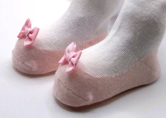 White tights with pink pump and polka dot bow