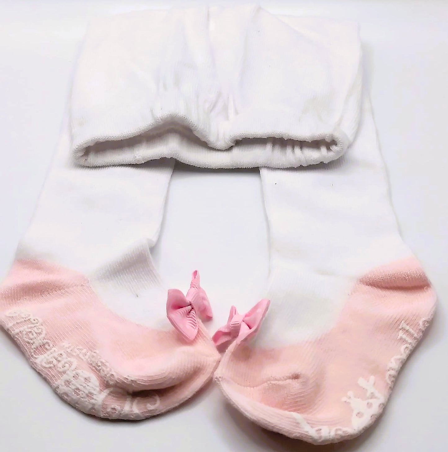 White tights with pink pump and polka dot bow