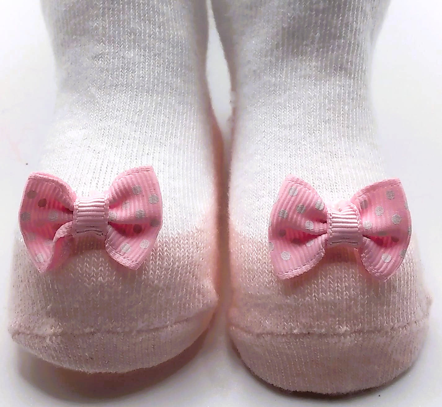 White tights with pink pump and polka dot bow