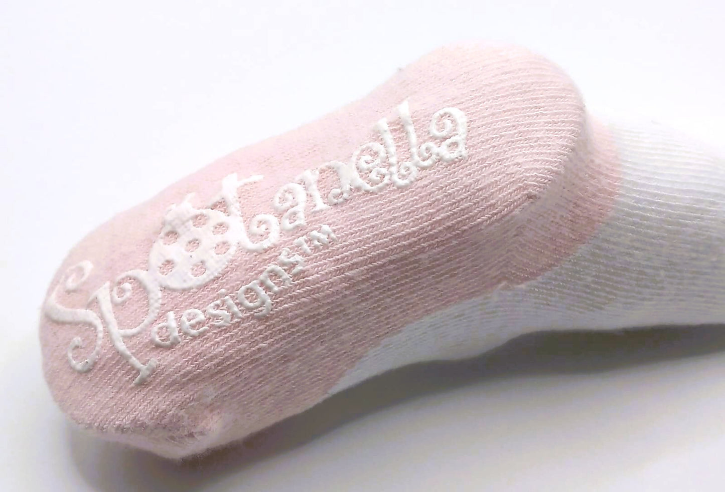 White tights with pink pump and polka dot bow