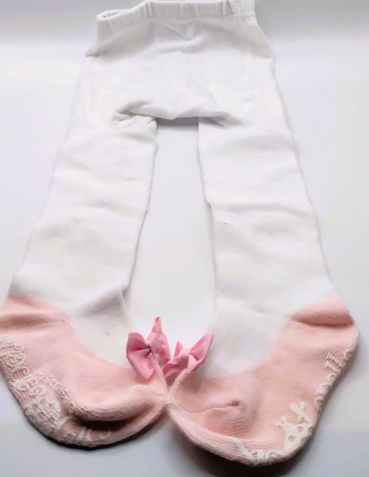White tights with pink pump and polka dot bow